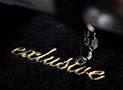 custom embroidery gold word on dark shirt